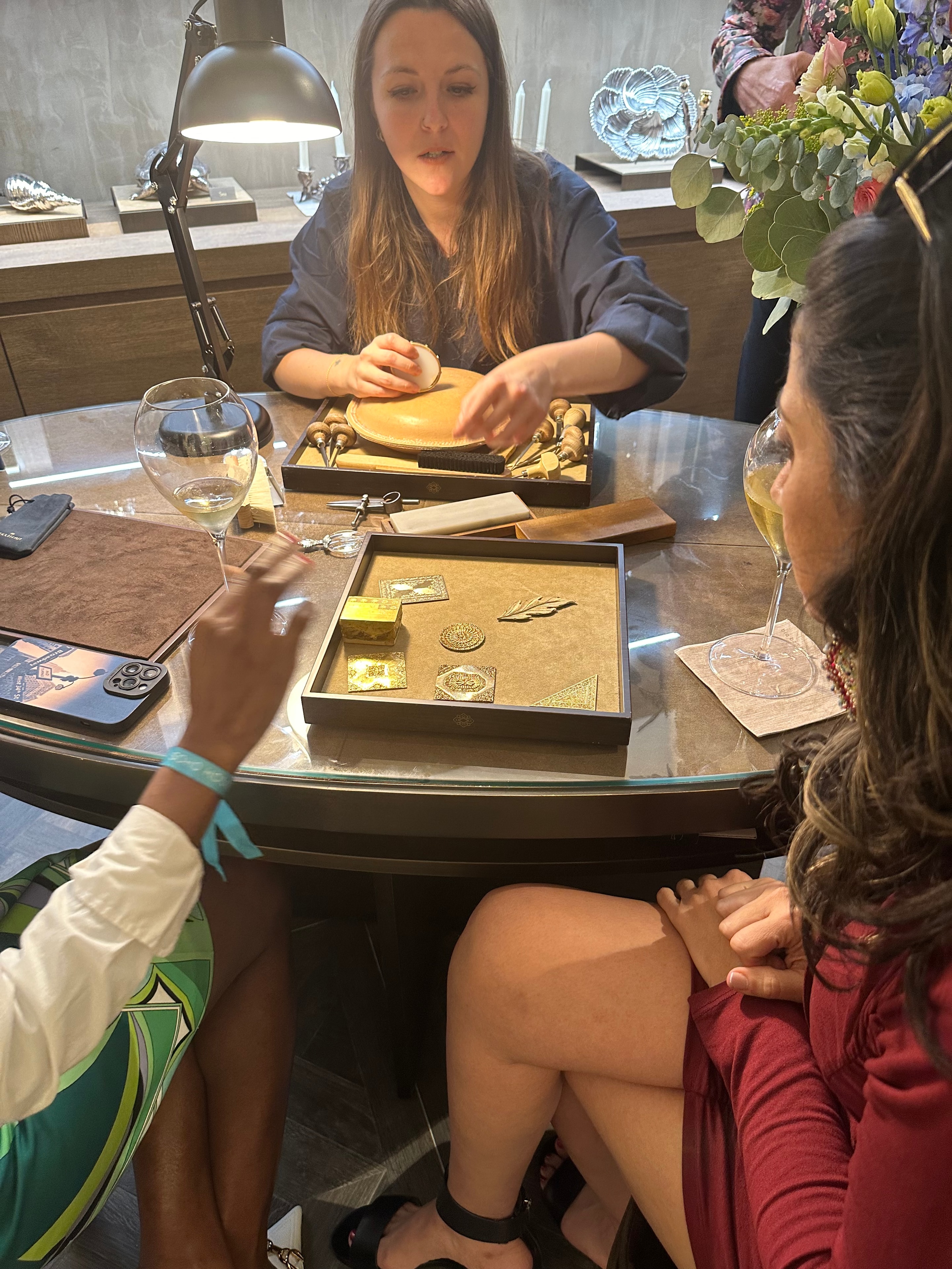 Guests examining Buccellati jewelry at the Bal Harbour reopening
