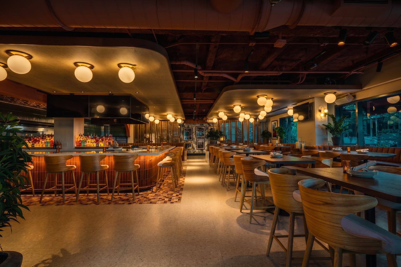 Grand Public's expansive indoor-outdoor space and wraparound bar.