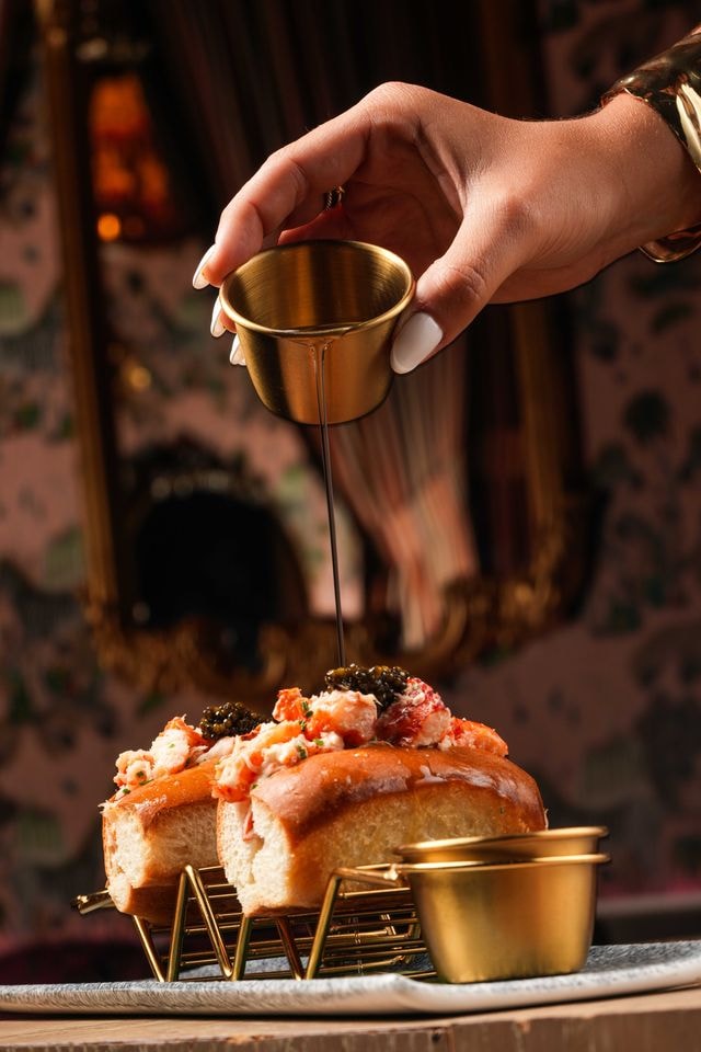 Lobster with caviar and tableside gold sauce pour at Habibi Miami anniversary dinner