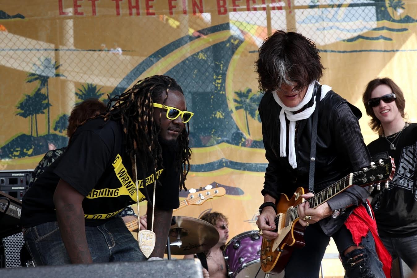 T-Pain joins Joe Perry on stage for a live rendition of "Walk This Way" at the Land Shark Tailgate Stage
