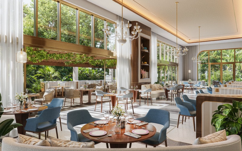 Luminous luxury residential lounge interior with floor-to-ceiling windows, warm wood tones, blue accent chairs, and tropical garden views