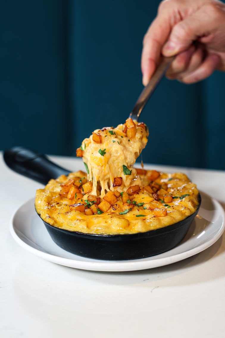 R House Wynwood butternut squash mac and cheese in a cast-iron skillet