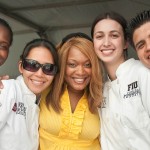 Food Network Celebrity chef Sunny Ande<br />rson, center, and FIU School of Hospitality's students at the Grand Tasting Village.