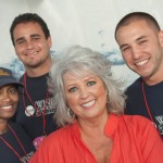 Food Network Celebrity Chef Paula Deen, front, poses with FIU School of Hospitality students at the Grand Tasting Village.