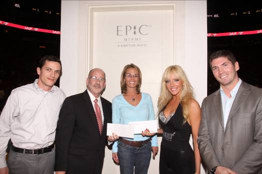 From L to R: Alessandro Pasalaqua, Chief Engineer, EPIC Hotel; Eric Jellson, Area Director of Sales and Marketing, Kimpton Hotels; Miami Heat EPIC Halftime Contest winner; Miami HEAT Dancer and exhale spa Core Fusion® instructor Julie; and Mike Haycook, Operations Manager, Area 31 Restaurant, EPIC Hotel.