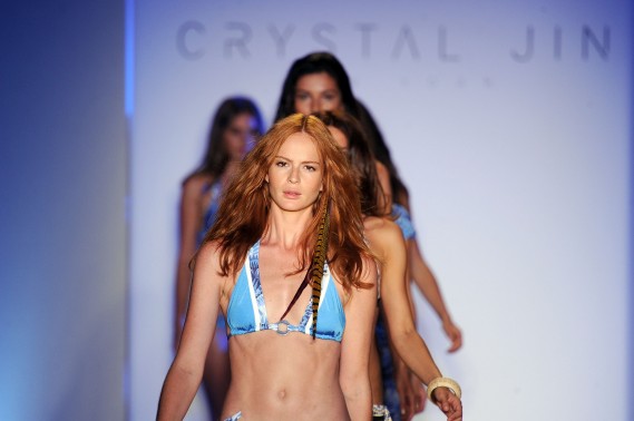 Models walk the runway for the Crystal Jin show during Mercedes Benz Fashion Week Swim 2012 at The Raleigh on July 15, 2011 in Miami Beach, Florida. (Photo by Frazer Harrison/Getty Images for Crystal Jin)
