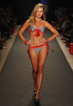 A model walks the runway at the Beach Bunny Swimwear show during Mercedes-Benz Fashion Week Swim at The Raleigh on July 15, 2011 in Miami Beach, Florida.