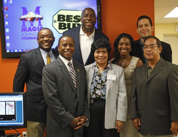 Best Buy and the Magic Johnson Foundation yesterday unveiled a technology makeover for the Magic Johnson Foundation Community Empowerment Center at NANAY Community Center in North Miami. Through new product integration, and on-site support from Best Buy’s Geek Squad, the updated center has been reconfigured to create a connected classroom environment as well as an expanded curriculum. Best Buy also is installing new technology throughout the NANAY Center to facilitate group learning and NANAY’s ability to connect with and utilize external resources. Pictured from L-R are: Back Row: Miami Dade County Commissioner Jean Monestime, Earvin “Magic” Johnson, Best Buy District Customer Solutions Manager John Robinson, Front Row: Andre D. Pierre, Esq., Mayor of North Miami, NANAY President Jocelyn Bruce, MD, Bernadette Pierre and NANAY Center Director Bennie Trinidad. (Photo by Hans Deryk for Best Buy)
