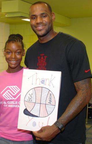 LeBron James accepts thanks from Victoria Woods at new LeBron James Boys & Girls Club in Akron. (Boys & Girls Clubs of America) 