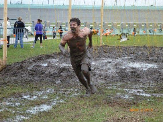 One participant regains his footing after completing the Electric Shock Therapy portion of Tough Mudder on Saturday