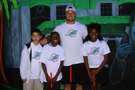 Austin Spitler with students from Henry S. Reeves Elementary at Monster Mini Golf in Miramar