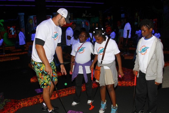 Brandon Fields with students from Henry S. Reeves Elementary at Monster Mini Golf in Miramar