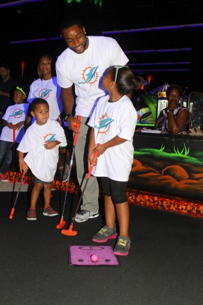 Marcus Thigpen with students from Henry S. Reeves Elementary at Monster Mini Golf in Miramar