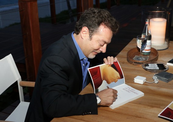 FL: Author Juan Carlos Botero signds copy of his book The Art of Fernando Botero