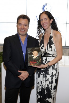 FL: Author Juan Carlos Botero signds copy of his book The Art of Fernando Botero