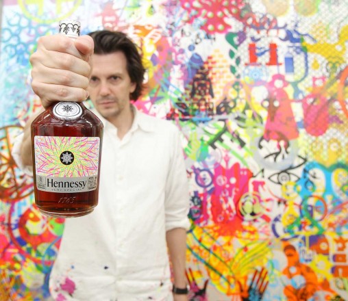 Ryan McGinness holds the Hennessy V.S Limited Edition bottle in his Chinatown Studio