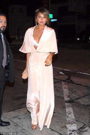 Chrissy Teigen wore a Maria Lucia Hohan pantsuit and Doves by Doron Paloma diamond earrings while stepping out to a post-VMAs dinner with John Legend at Craig’s restaurant in West Hollywood on August 30. 