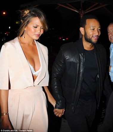 Chrissy Teigen wore a Maria Lucia Hohan pantsuit and Doves by Doron Paloma diamond earrings while stepping out to a post-VMAs dinner with John Legend at Craig’s restaurant in West Hollywood on August 30.