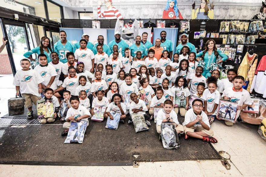 Miami Dolphins in the Community Halloween Costume Shopping with a Fin