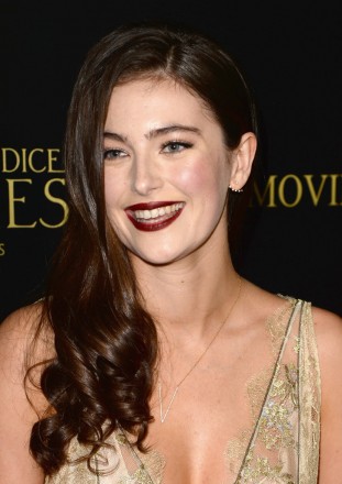 Actress Millie Brady wore a Djula diamond earring and necklace to the premiere of Screen Gems' "Pride and Prejudice and Zombies" on January 21, 2016 in Los Angeles, California. 