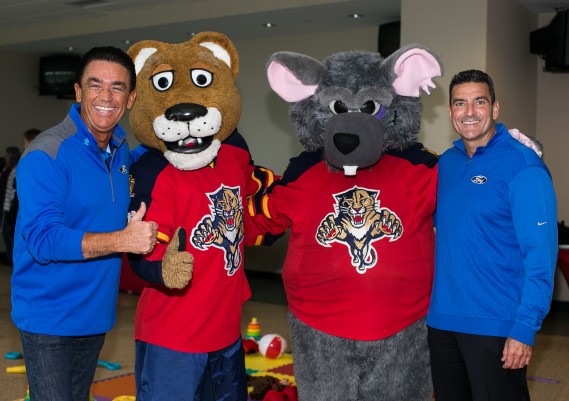 Allan Young, Chairman of South Florida Ford, Stanley C Panther, Victor E. Rat and Manny Villamanan, Owner of Midway Ford