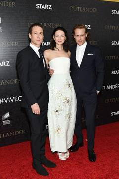 From L-R: “Outlander” series stars Tobias Menzies, Caitriona Balfe and Sam Heughan on the red carpet of the NY premiere at the American Museum of Natural History. 