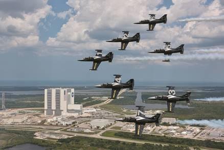 The Breitling Jet Team flies over the Kennedy Space Center