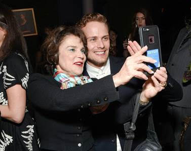 From L-R:  Actress and “Outlander” fan Tovah Feldshuh (“The Walking Dead”) poses for a selfie with series star Sam Heughan. 