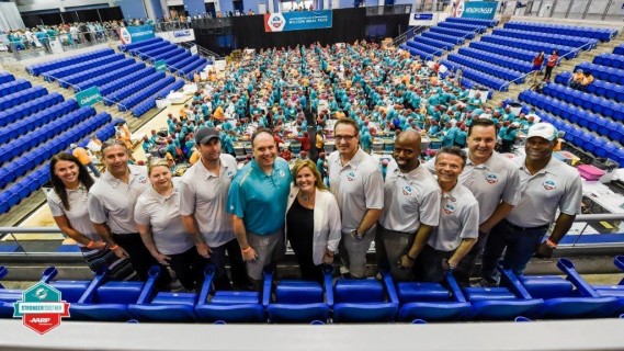 (L-R) Miami Dolphins Vice President of Partnership Activation and Retention Nicole Bienert, Miami Dolphins Senior Vice President, Chief Commercial Officer Todd Kline, AARP Foundation Senior Vice President Emily Allen, Miami Dolphins Head Coach Adam Gase, Miami Dolphins Executive Vice President of Football Operations Mike Tannenbaum, AARP Foundation President Lisa Marsh Ryerson, Miami Dolphins President and Chief Executive Officer Tom Garfinkel, Miami Dolphins Senior Vice President of Communications and Community Affairs Jason Jenkins, AARP Foundation Vice President of Corporate and Foundation Relations Stephen Venute, Miami Dolphins Senior Vice President, Chief Marketing Officer Jeremy Walls and Senior Vice President, Special Projects and Alumni Relations Nat Noore.