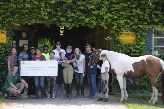 GAB presents $10k check to Good Hope Equestrian Center in Homestead