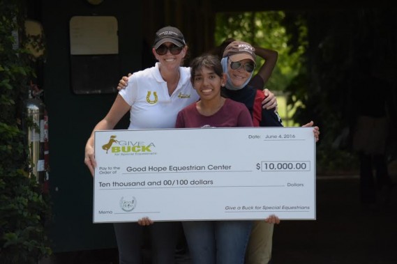 GAB co-founder Dr. Heather Kuhl presents donation to Dr. Peggy Bass Executive Director of Good Hope Equestrian Center
