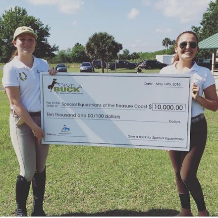 GAB co-founder Isabel Ernst and GAB Young Ambassador Sophia North present check to Special Equestrians of The Treasure Coast