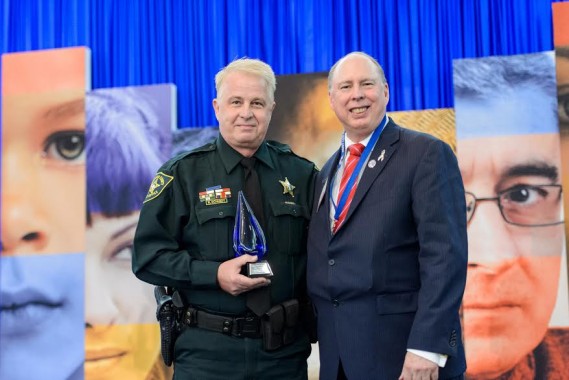 CIT Officer of the Year Award to BSO Deputy Robert Schmidt  and Major Sam Cochran, First Memphis Police Department CIT Coordinator and CIT International Co-Chairperson