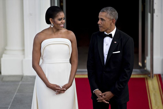 U.S. President Barack Obama, right, and U.S. First Lady Michelle Obama talk as they wait during an arrival for Singapore Prime Minister Lee Hsien Loong, not pictured, to the State Dinner on the North Portico of the White House in Washington, D.C., U.S., on Tuesday, Aug. 2, 2016. The occasion marks first official visit by a Singapore prime minister since 1985. Photographer: Andrew Harrer/Bloomberg via Getty Images
