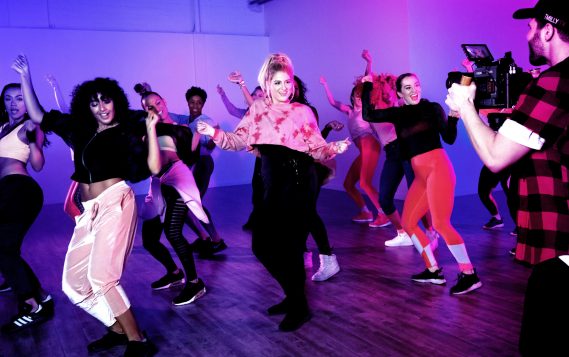The multi-platinum Trainor, dancing alongside an all-female ensemble, is the first recording artist to star in an official Zumba choreography video.