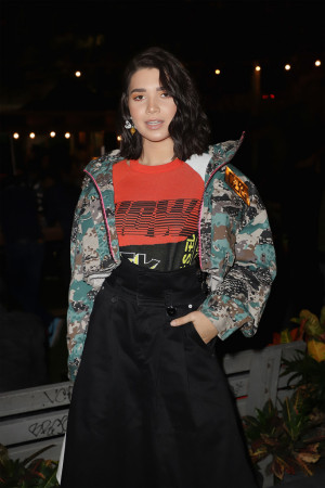 Vanessa Zambito: Field Jacket with Fluo Accents Women’s Cropped Jacket, Multicolored Jacquard Short Sleeve Knit, Black Cotton Wide Leg Pleated Pant all from the Diesel Spring 2019 Collection 