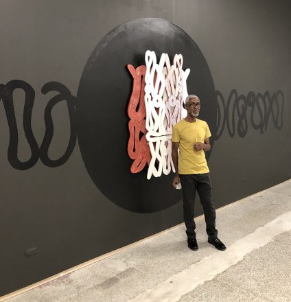 Onajide Shabaka in front of his installation They continued walking upstream, 2018 at Emerson Dorsch
