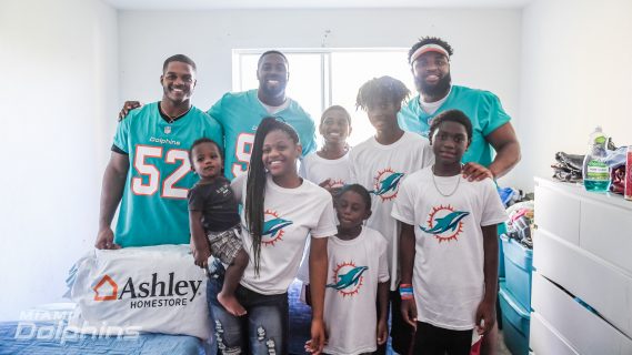 Miami Dolphins in Collaboration with Ashley Homestore Visits Family to Deliver and Assemble Beds