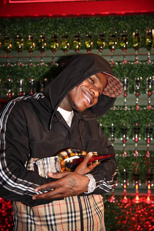 DaBaby holding the Swisher Sweets Spark Award