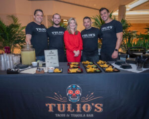 Todd Lawrence, Tulio’s Tacos & Tequila Bar general manager (left), with Melissa Milroy of Galleria Fort Lauderdale (center) and the Tulio’s Tacos & Tequila Bar restaurant team