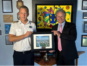 Port Canaveral CEO Capt. John Murray (R) presents framed photo of Port Canaveral to Allure of the Seas’ Capt. Tobias Oster (L) welcoming the ship to Port Canaveral (Photo: Canaveral Port Authority)
