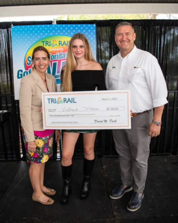 Miami-Dade County Commissioner Raquel Regalado (left) and SFRTA/Tri-Rail Executive Director David Dech (right) with first place winner Victoria Johnson during Tri-Rail’s 2023 “South Florida’s Kids Got Talent” competition. Photo Credit: Michael Murphy Photography