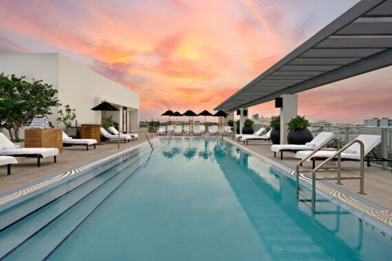 Kimpton Angler's rooftop pool and sun deck with panoramic views of Miami Beach.