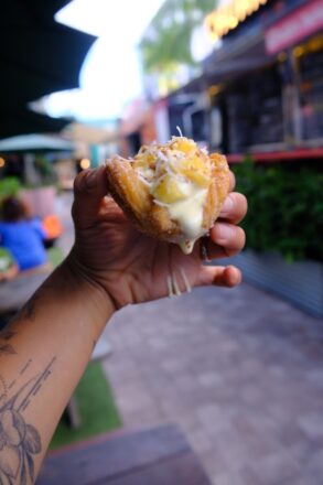 Hot Mango:: Fresh mango with sugar tajín and spicy mango sauce in Santo Dulce's signature churro taco shell