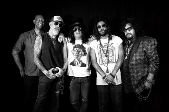 Above: Slash Blues Ball (L-R) are Michael Jerome (drums), Johnny Griparic (bass), Slash (guitars), Tash Neal (vocals/guitars), and Teddy ‘ZigZag’ Andreadis (keys/vocals). 