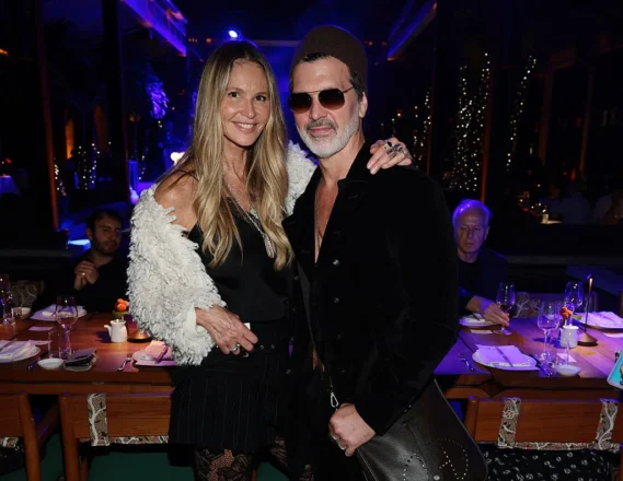 Supermodel Elle Macpherson and acclaimed musician Doyle Bramhall made a stylish appearance at The Setai Miami Beach, showcasing glamour and talent during Miami Art Week. Their presence added an extra touch of elegance to the exclusive event.Photo credit: Dimitrios Kambouris/Getty Images.