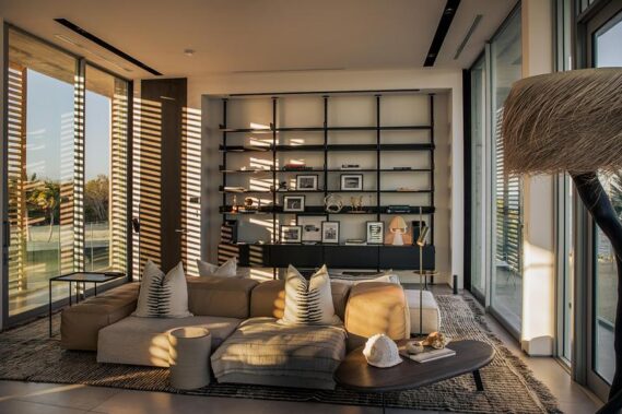 Floor to ceiling windows allow natural light to pour into the house, while strategically placed louvers help with shading and cooling.Photo credit: Ryan Lester, Architecture Sarasota