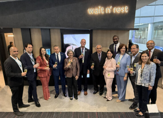 Miami-Dade County and Wait n’ Rest officials toast the grand opening of Wait n’ Rest at MIA.